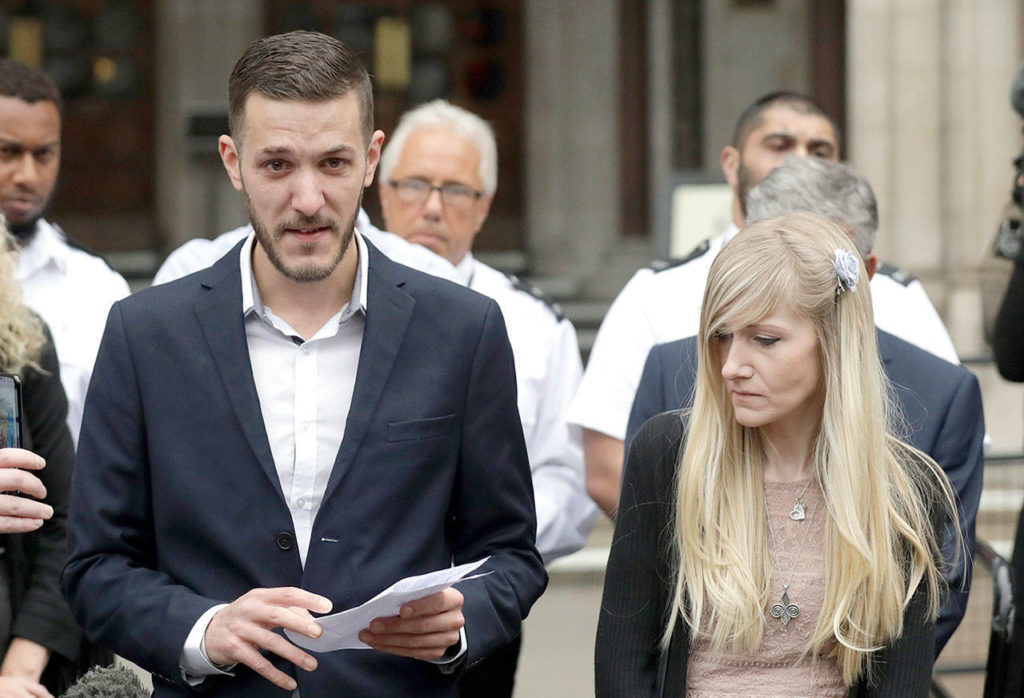 In this photo dated July 24, Chris Gard, the father of Charlie Gard, reads a statement next to Charlie’s mother, Connie Yates, at the end of their case at the High Court in London. (AP Photo/Matt Dunham, FILE)
