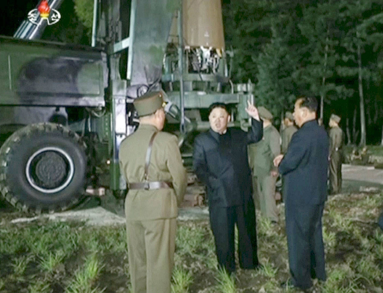 In this image made from video by North Korea’s KRT on Friday, July 28, 2017, North Korean leader Kim Jung Un, center, gestures at the site of a missile test at an undisclosed location in North Korea. The clear message after Friday’s late-night test, the second in a month of a missile that may be able to reach most of the U.S. mainland: Get used to this _ it’s the new normal. (KRT via AP Video)