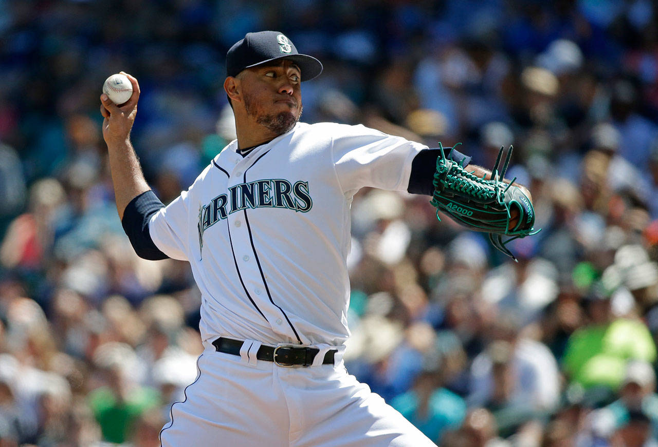Seattle’s Yovani Gallardo throws a pitch in the first inning of Saturday’s game at Safeco Field. (AP Photo/Ted S. Warren)