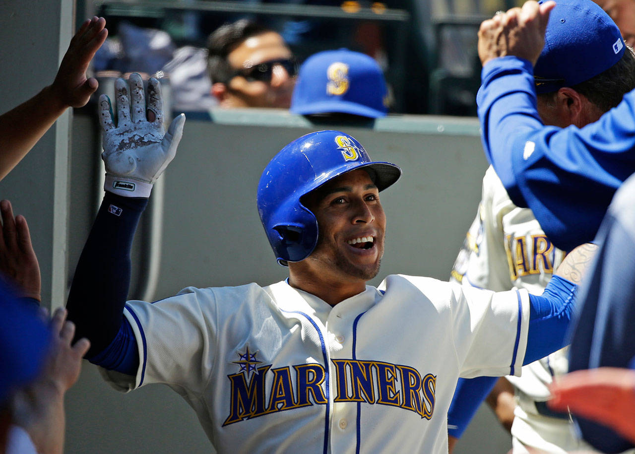 The Mariners’ Leonys Martin smiles in the dugout after hitting a solo home run in the second inning of a game against the Mets on July 30, 2017, in Seattle. (AP Photo/Ted S. Warren)