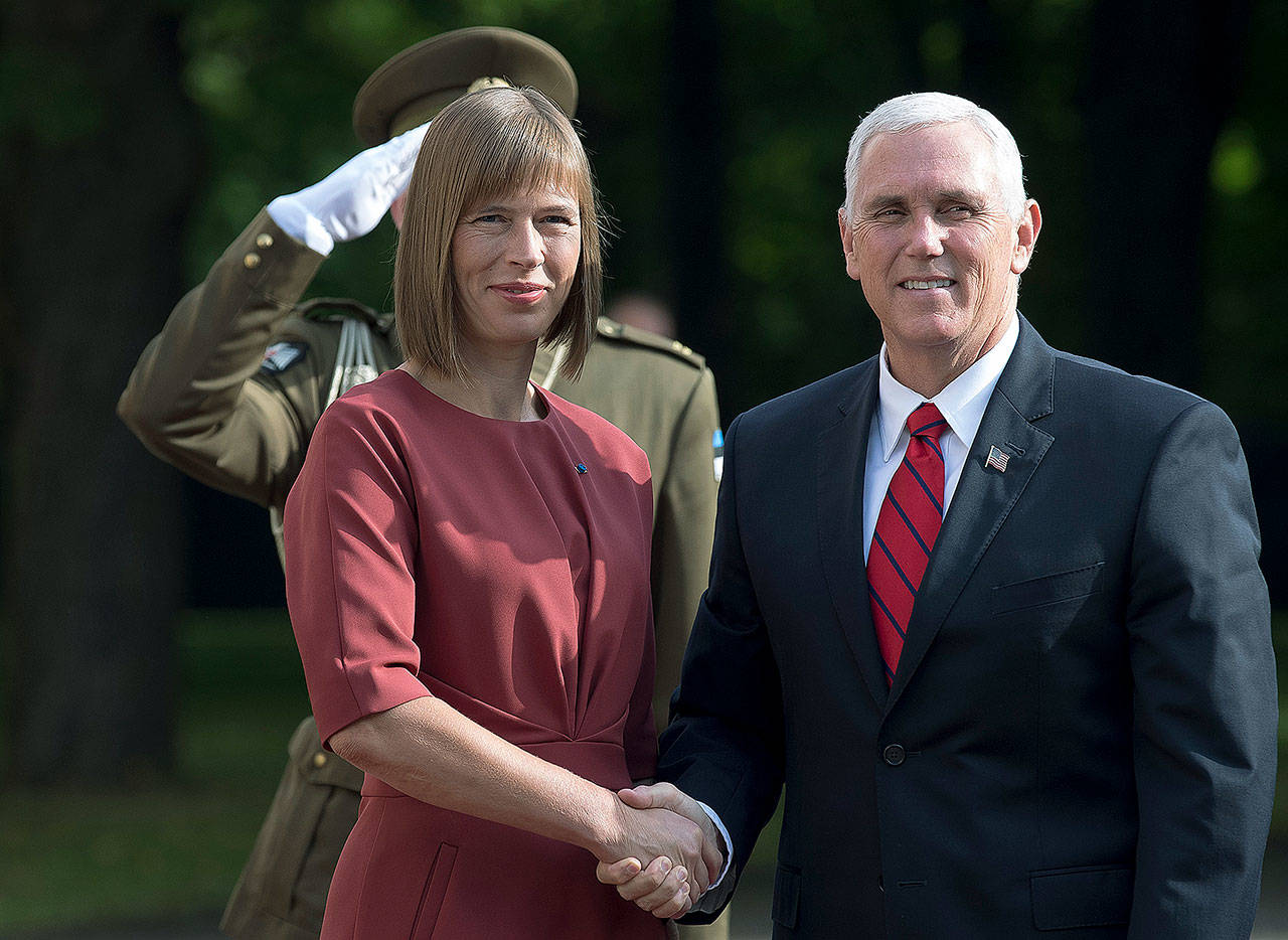 U.S. Vice President Mike Pence (right) and Estonia’s president, Kersti Kaljulaid, pose for photographers prior to their meeting at the Kadriorg Palace in Tallinn, Estonia, on Monday. (AP Photo/Mindaugas Kulbis)