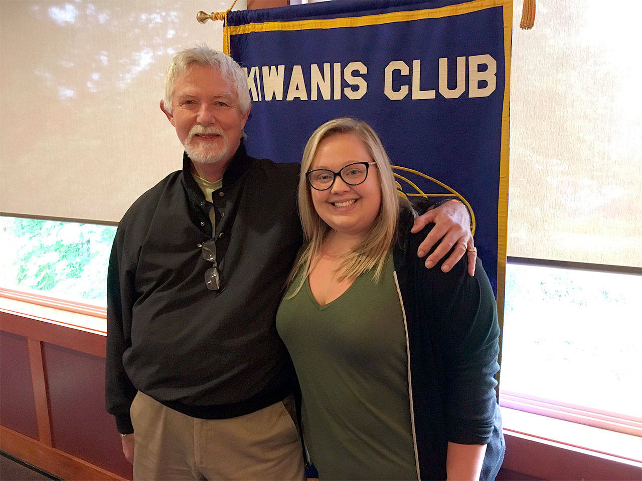 Tom Walker (left), a longtime hair stylist from Snohomish, is honored as the Kiwanis Club of Snohomish Citizen of the Quarter by club President Chelsea Saunders. (Contributed photo)