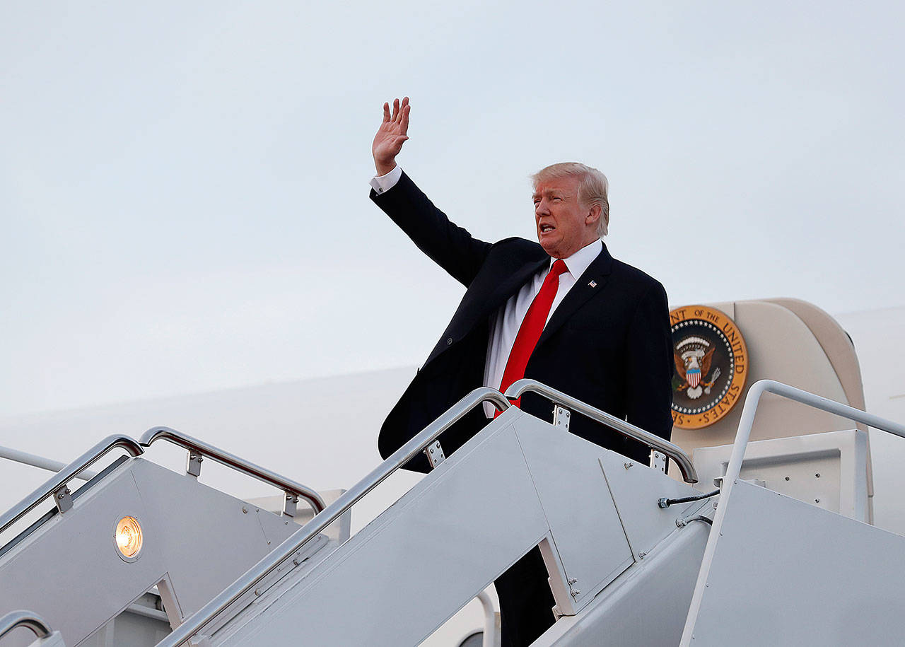 President Donald Trump arrives on Air Force One on Monday at Andrews Air Force Base, Maryland, as he returns from Trump National Golf Club in Bedminster, New Jersey. (AP Photo/Carolyn Kaster)