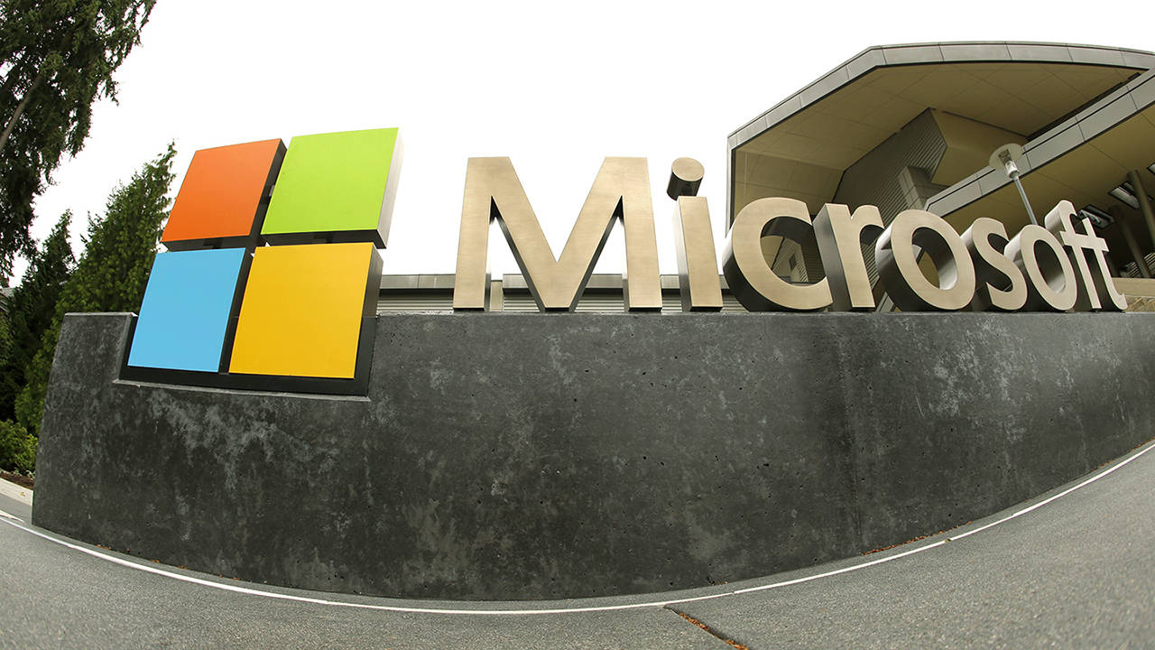 This 2014 photo shows the Microsoft Corp. logo outside the Microsoft Visitor Center in Redmond. (AP Photo/Ted S. Warren, File)