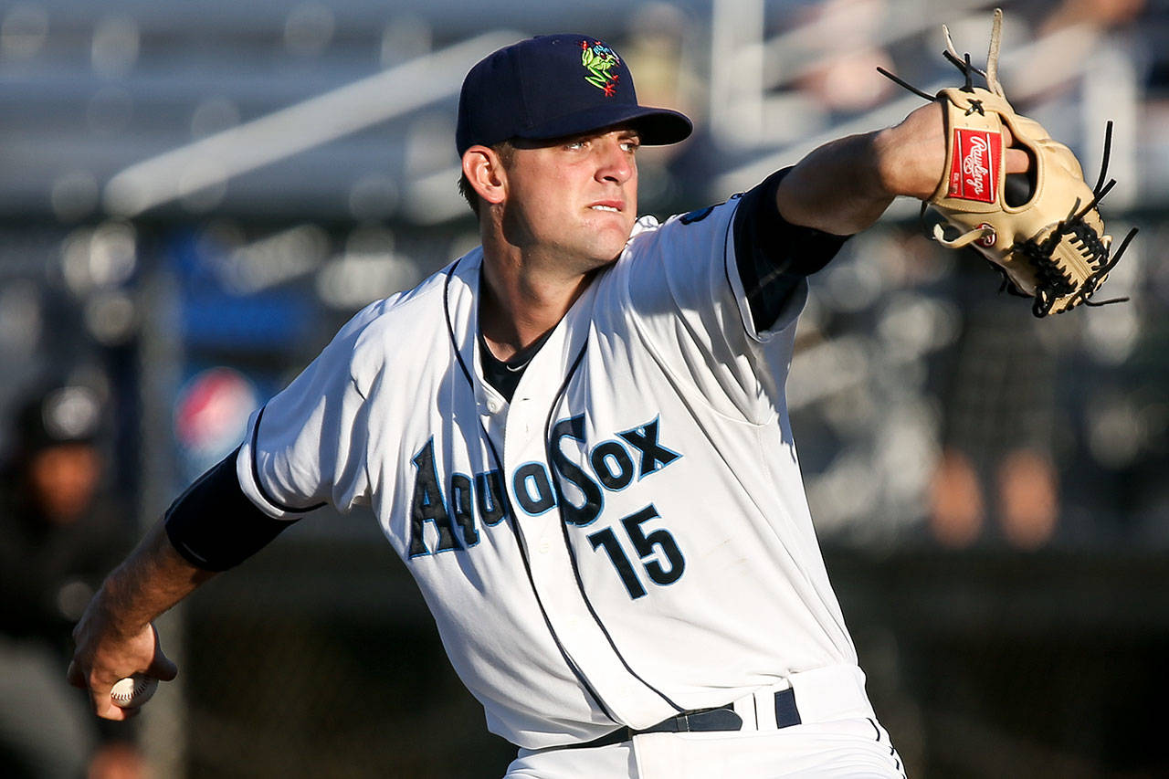 Everett’s Ryne Inman pitches against the Tri-City Dust Devils Wednesday night at Everett Memorial Stadium. (Kevin Clark / The Herald)