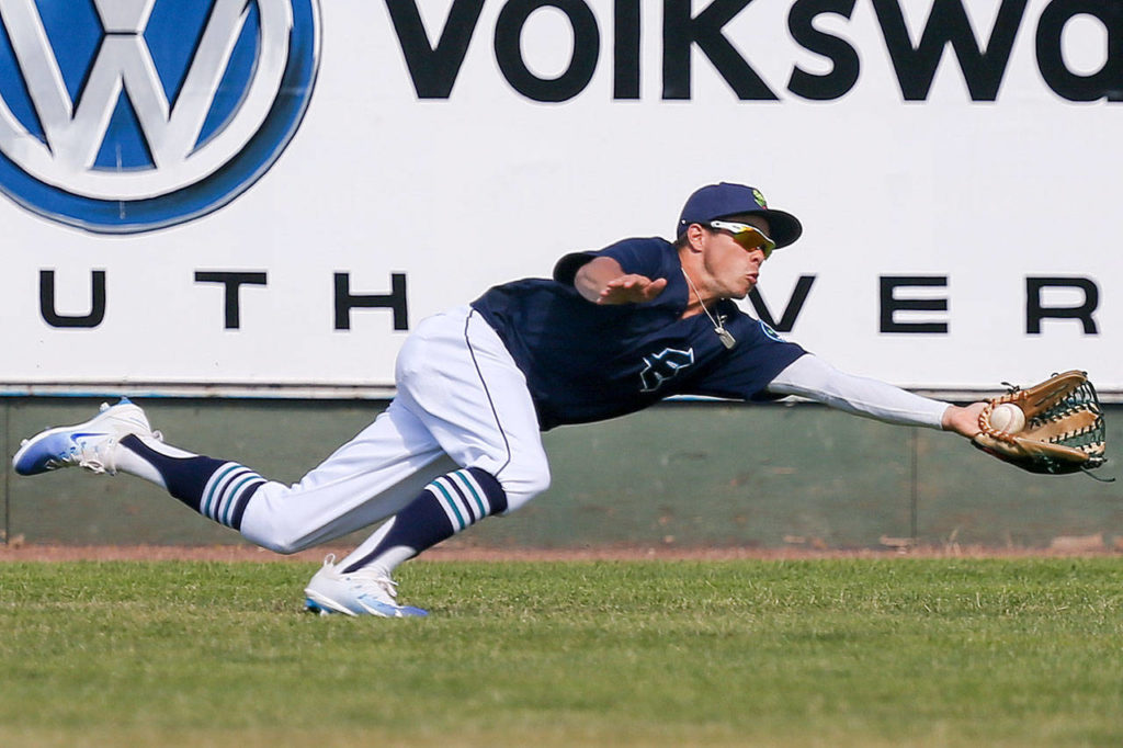 Everett’s Austin Grebeck makes the grab Sunday afternoon at Everett Memorial Stadium in Everett on July 9, 2017. Salem-Keizer won 7-6. (Kevin Clark / The Herald)
