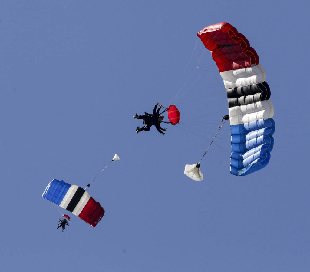 Skydivers float back to the ground after deploying their parachutes at Skydive Snohomish on Saturday, July 1. (Ian Terry / The Herald)
