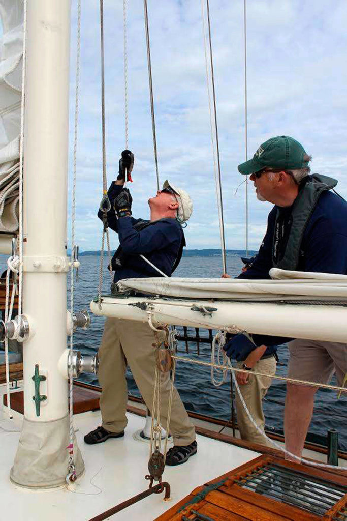 Retired Coupeville residents David Young (left) and Christopher Bradley enjoy volunteering as crew for the Suva, a 68-foot schooner owned by Coupeville Maritime Heritage Foundation. Getting out on the water and sailing is good for the body, heart and soul, they say. (Patricia Guthrie/Whidbey News-Times)
