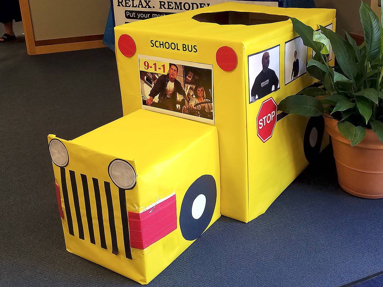 Volunteers made cardboard school buses as bins for Marysville’s annual Stuff the Bus campaign, which collects donated school supplies for kids in need. (Marysville Community Food Bank)