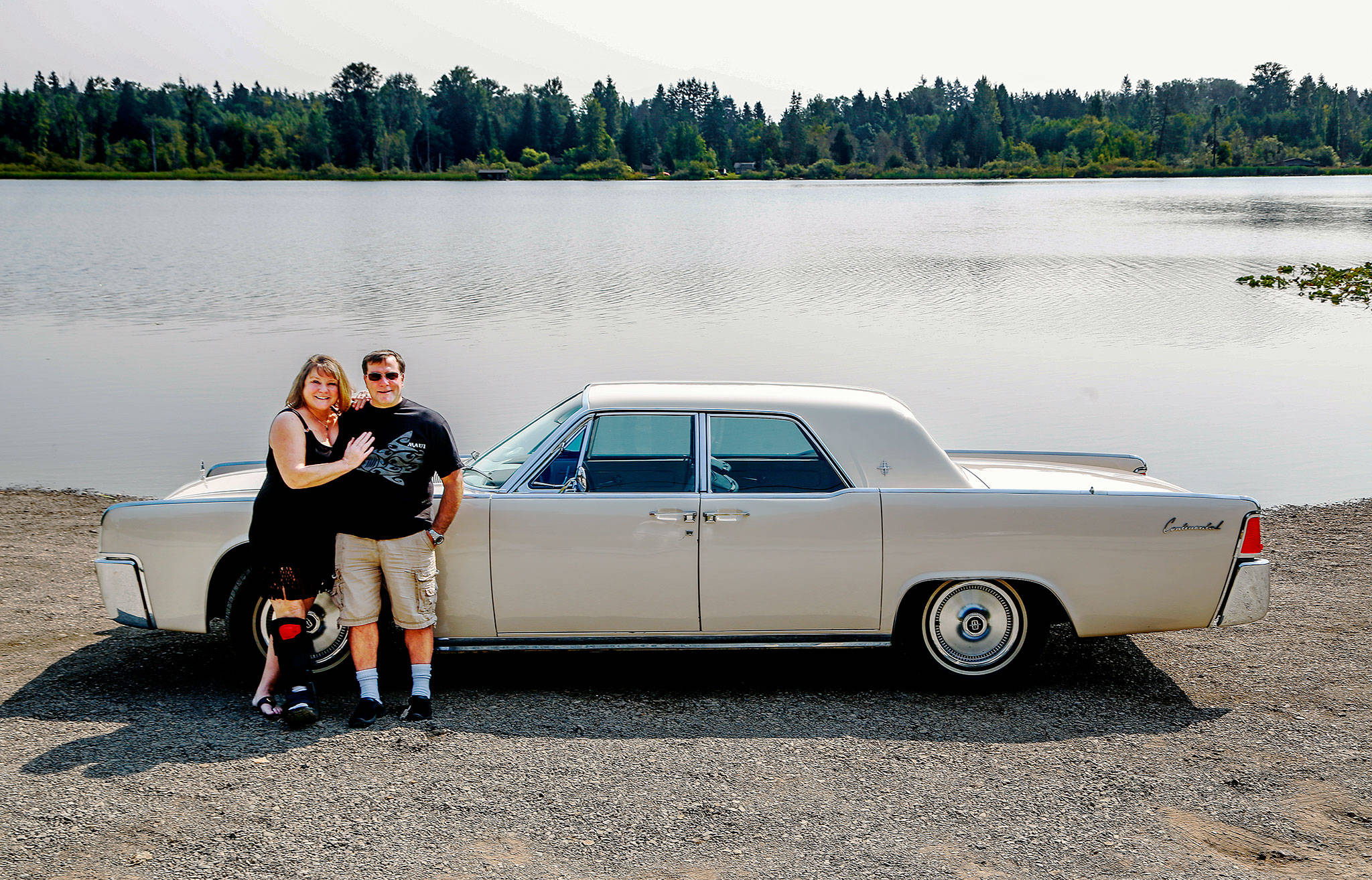 Almost as if out of an early ’60s magazine ad for the new Lincoln Continental, Vicki and Ron Selia park alongside Lake Cassidy to show off their newly acquired 1961 model that was once owned by actress Mary Pickford. (Dan Bates / The Herald)