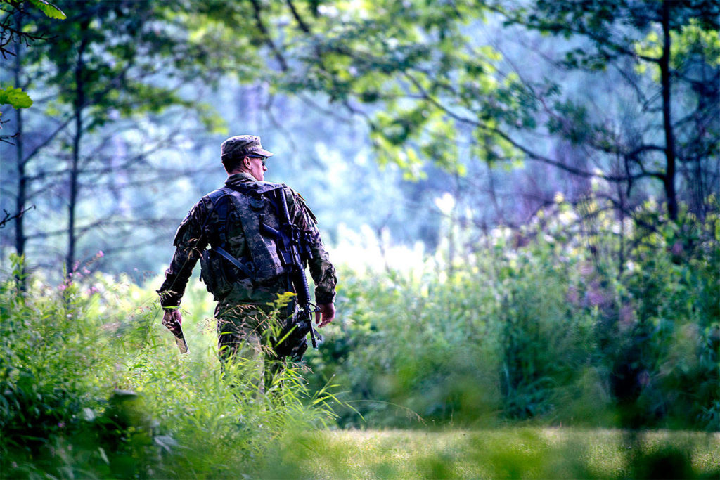 Sgt. Grant Reimers, a heavy vehicle driver with 1859th Light-Medium Transportation Company, Nevada National Guard, walks toward his first point for the daylight land navigation event during the 2017 Army National Guard Best Warrior Competition on July 19 at Camp Ripley, Minnesota. Competitors completed a night navigation event where they had to find three points in two hours before daylight land navigation event where they had to find five points in three hours. (Minnesota National Guard / Sgt. Sebastian Nemec)
