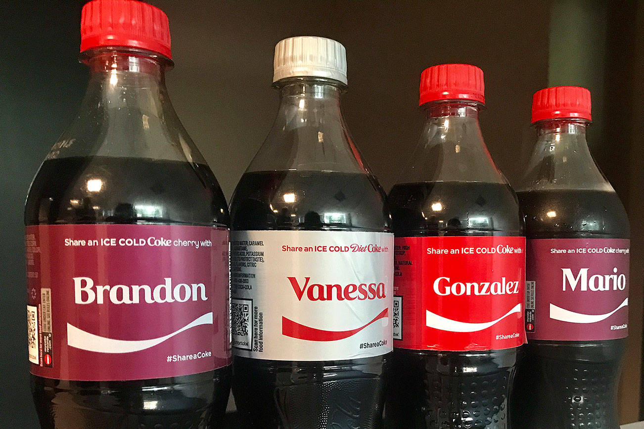 This summer’s “Share a Coke” campaign has more than 1,000 names on 20-ounce bottles of Coca-Cola products, including diet and cherry. (Photo by Ben Watanabe)