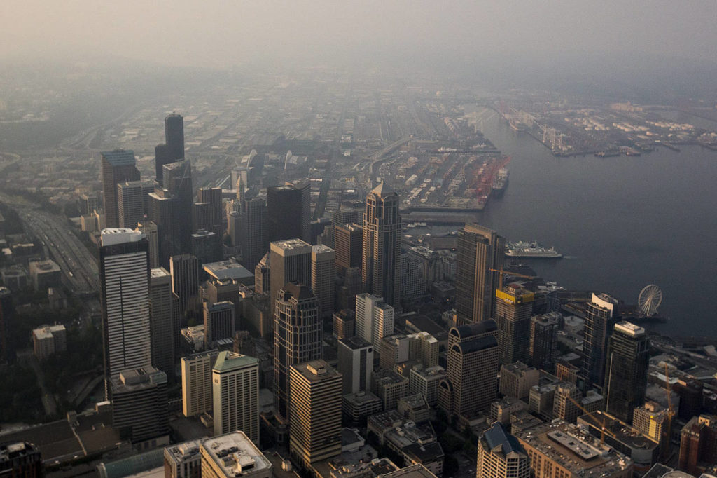 Hazy air, caused by smoke from wildfires blowing south from British Columbia, blankets downtown Seattle early Thursday morning on Aug. 3. (Ian Terry / The Herald)
