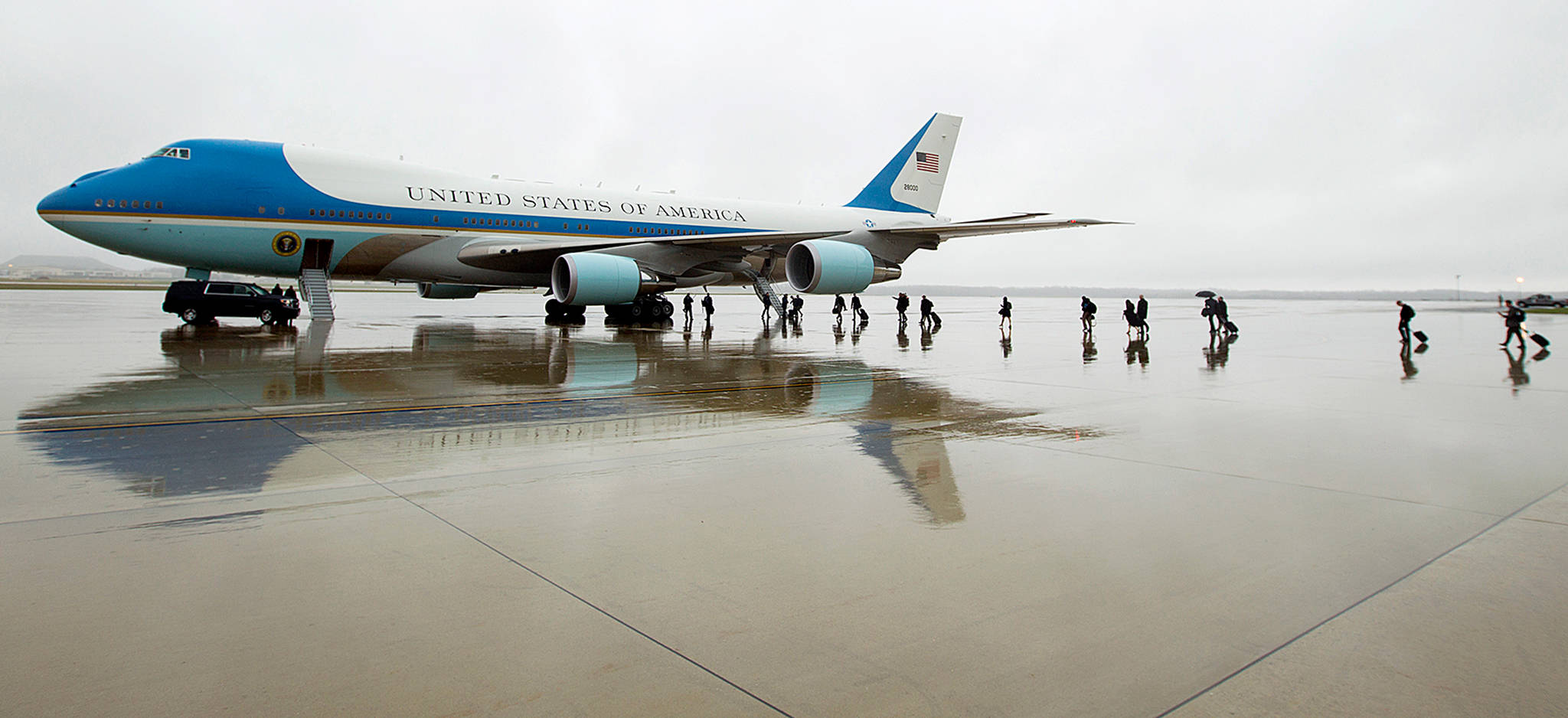 Members of the White House press corps board Air Force One at Andrews Air Force Base, Maryland, in April. The Air Force, which has been looking for ways to lower the cost of new planes for Air Force One, confirmed on Tuesday that it is talking to Boeing about buying two jumbo jets that were ordered but never delivered to a now-defunct Russian airline. (AP Photo/Jose Luis Magana, File)