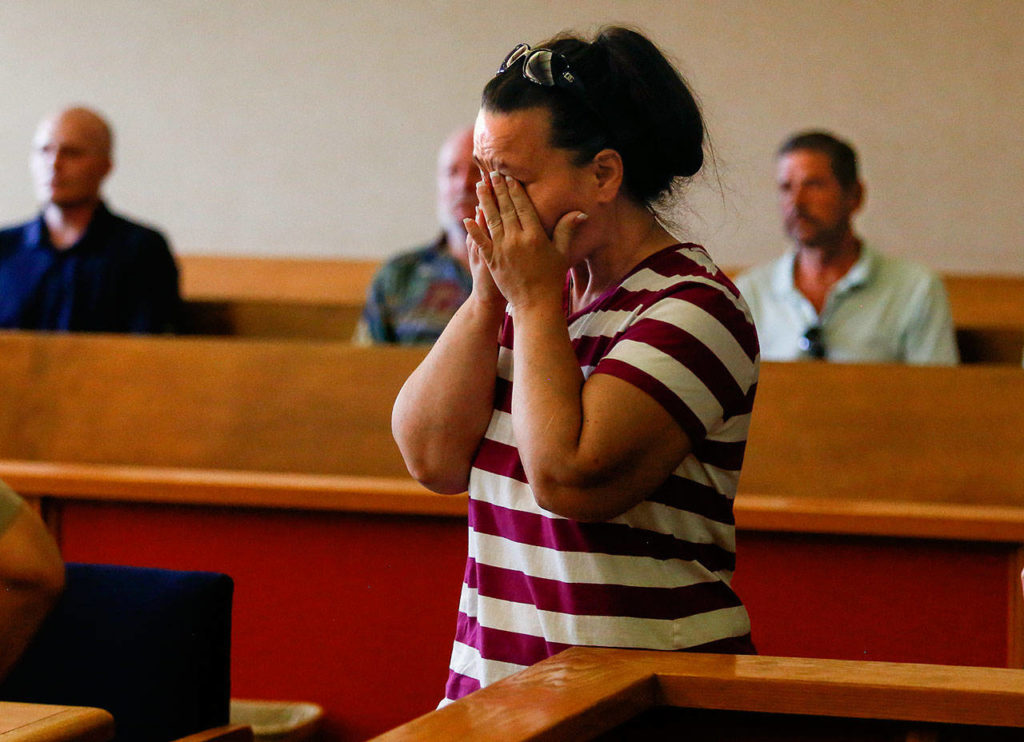 Stacy Strand, sister of murder victim Shannon Yeager, tries to hold back her emotions as she walks to the bench to speak during the sentencing hearing for John Derosia. (Dan Bates / The Herald)
