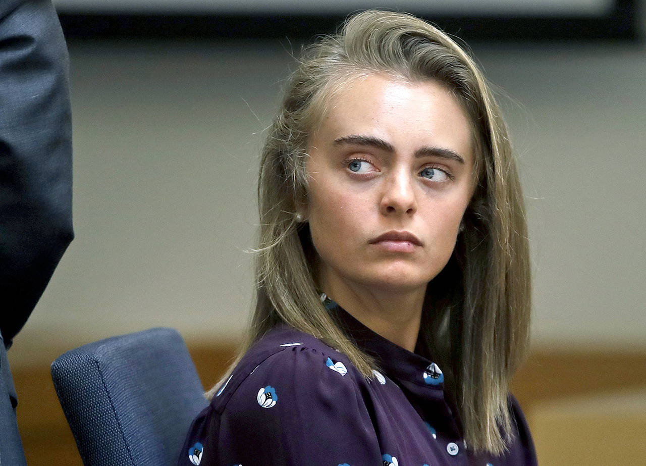 In this June 8 photo, defendant Michelle Carter listens to testimony at Taunton District Court in Taunton, Massachusetts. (AP Photo/Charles Krupa, Pool, File)