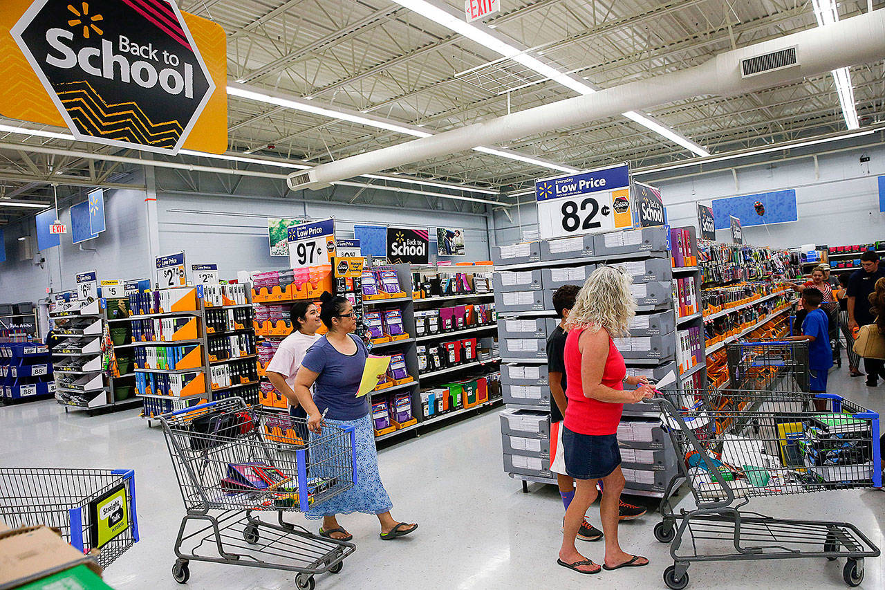 Customers browse school supplies at a Wal-Mart in Los Angeles on Thursday. (Bloomberg/Patrick Fallon)