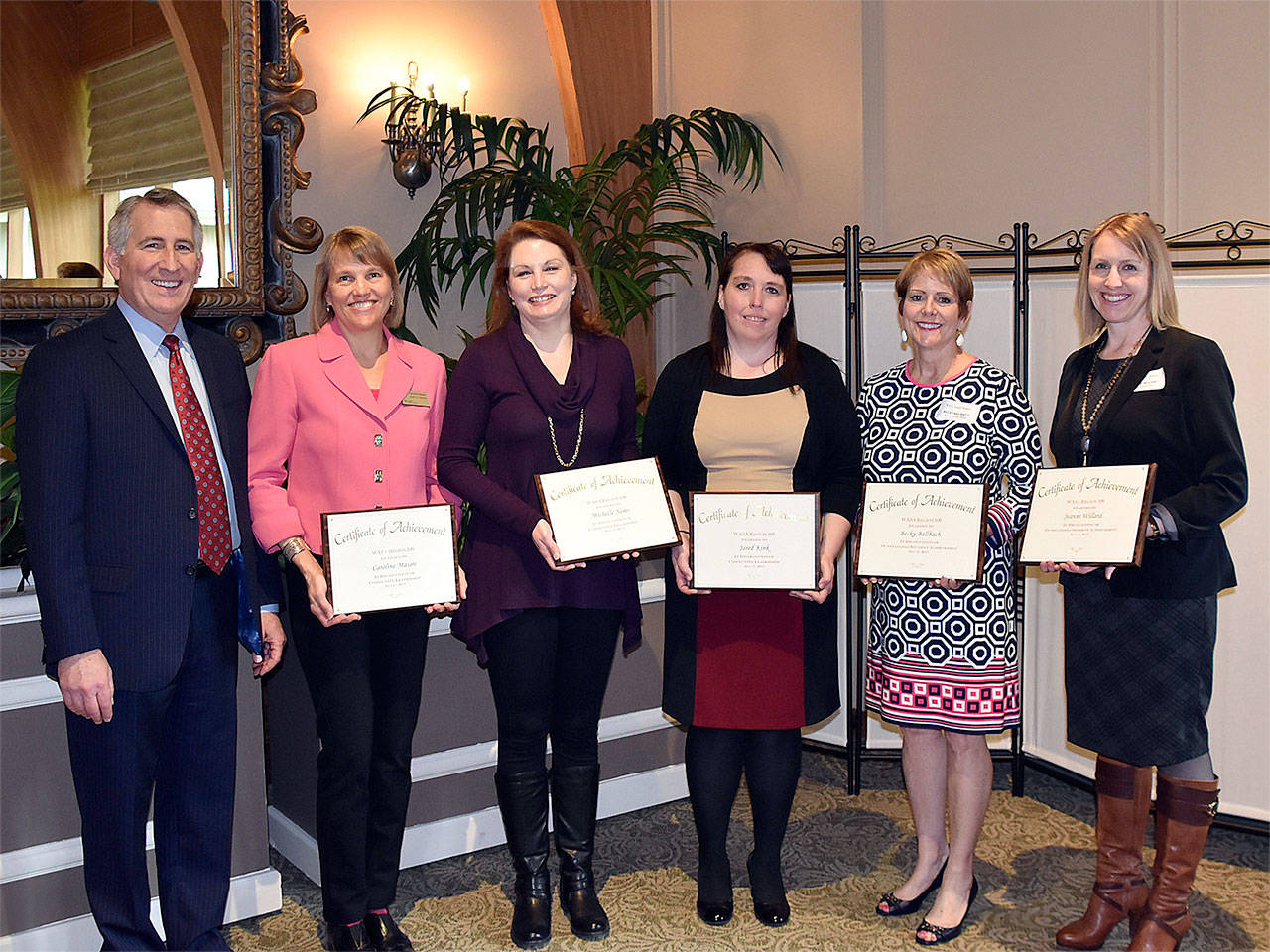 Everett School District Superintendent Gary Cohn (from left), Citizens for Everett Public Schools’ Caroline Mason, Michelle Nims and Jenny Steele (for Jared Kink), and educators Becky Ballbach and Jeanne Willard celebrate at a WASA awards luncheon May 11 in Everett. (Contributed photo)