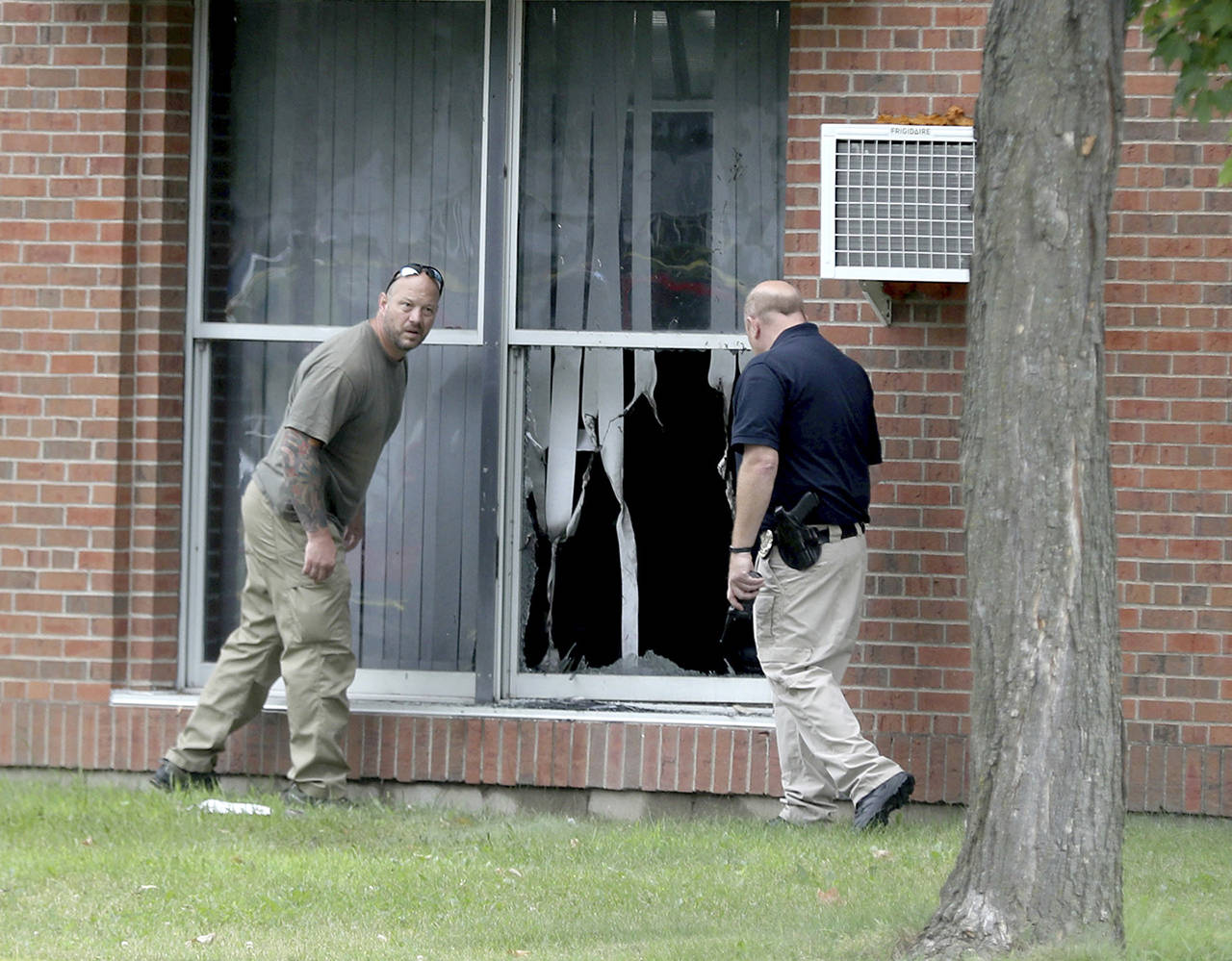 Law enforcement officials investigate an explosion at the Dar Al-Farooq Islamic Center in Bloomington, Minnesota, on Saturday. (David Joles/Star Tribune via AP)