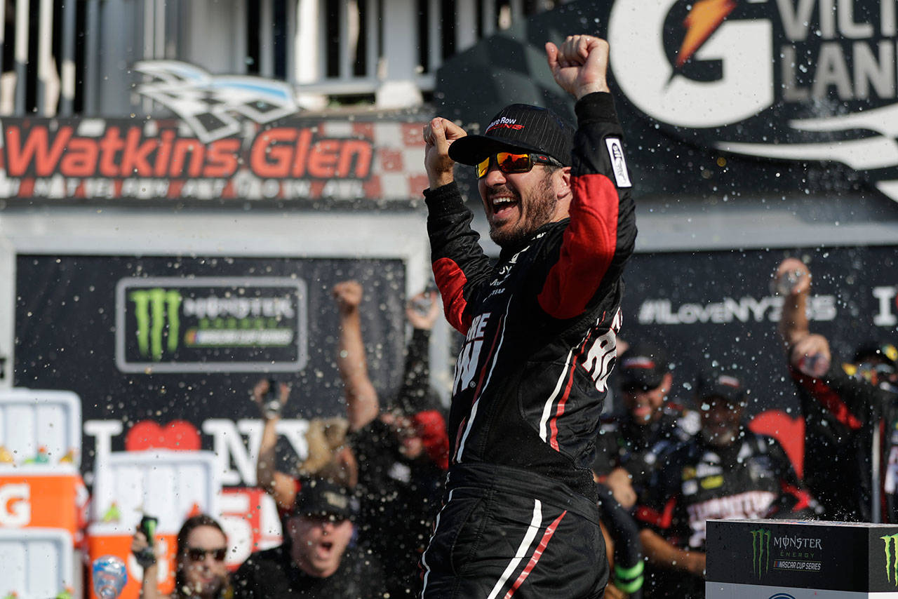 Martin Truex Jr. celebrates after winning the Monster Cup Series race on Aug. 6, 2017, in Watkins Glen, N.Y. (AP Photo/Matt Slocum)
