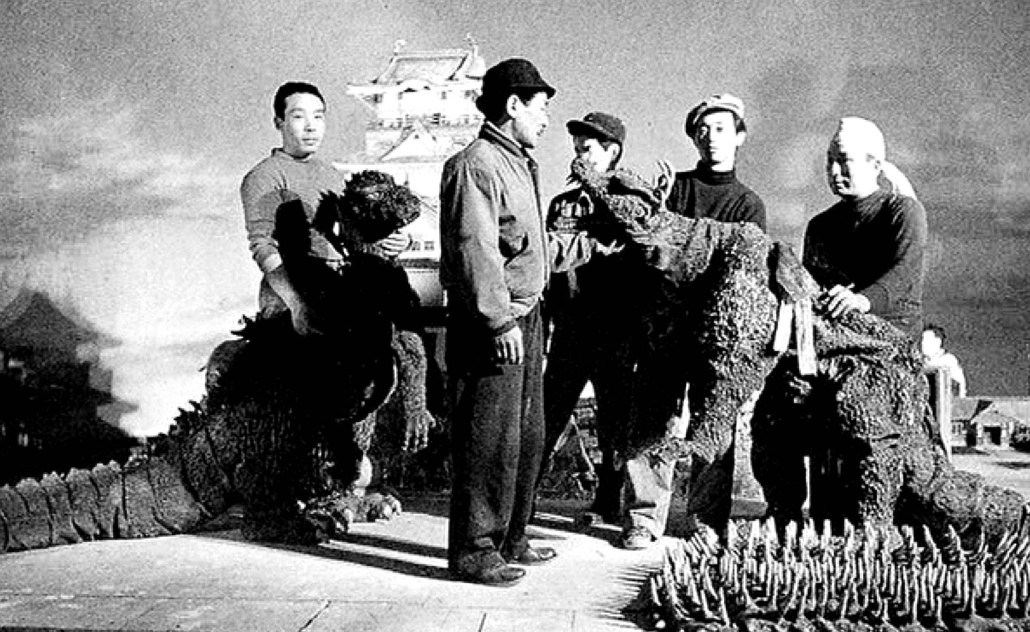 Suit fitting on the set of “Godzilla Raids Again” (1955), with Haruo Nakajima (left) portraying Godzilla. (Wikimedia Commons)