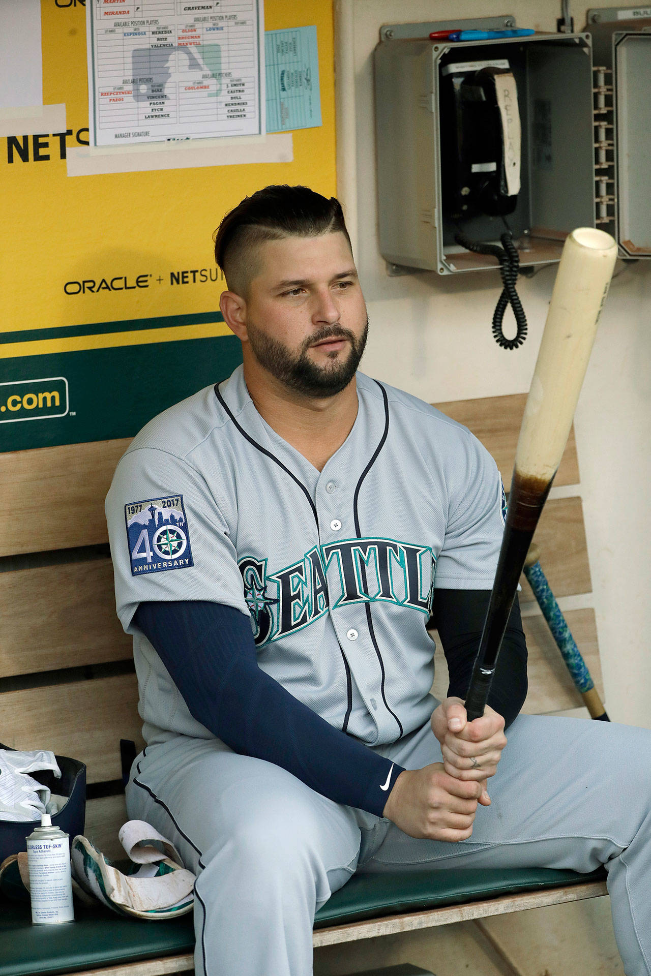Seattle’s Yonder Alonso gets ready to face his former team — the Oakland Athletics — in his Mariner debut Tuesday night in Oakland, California. (AP Photo/Marcio Jose Sanchez)