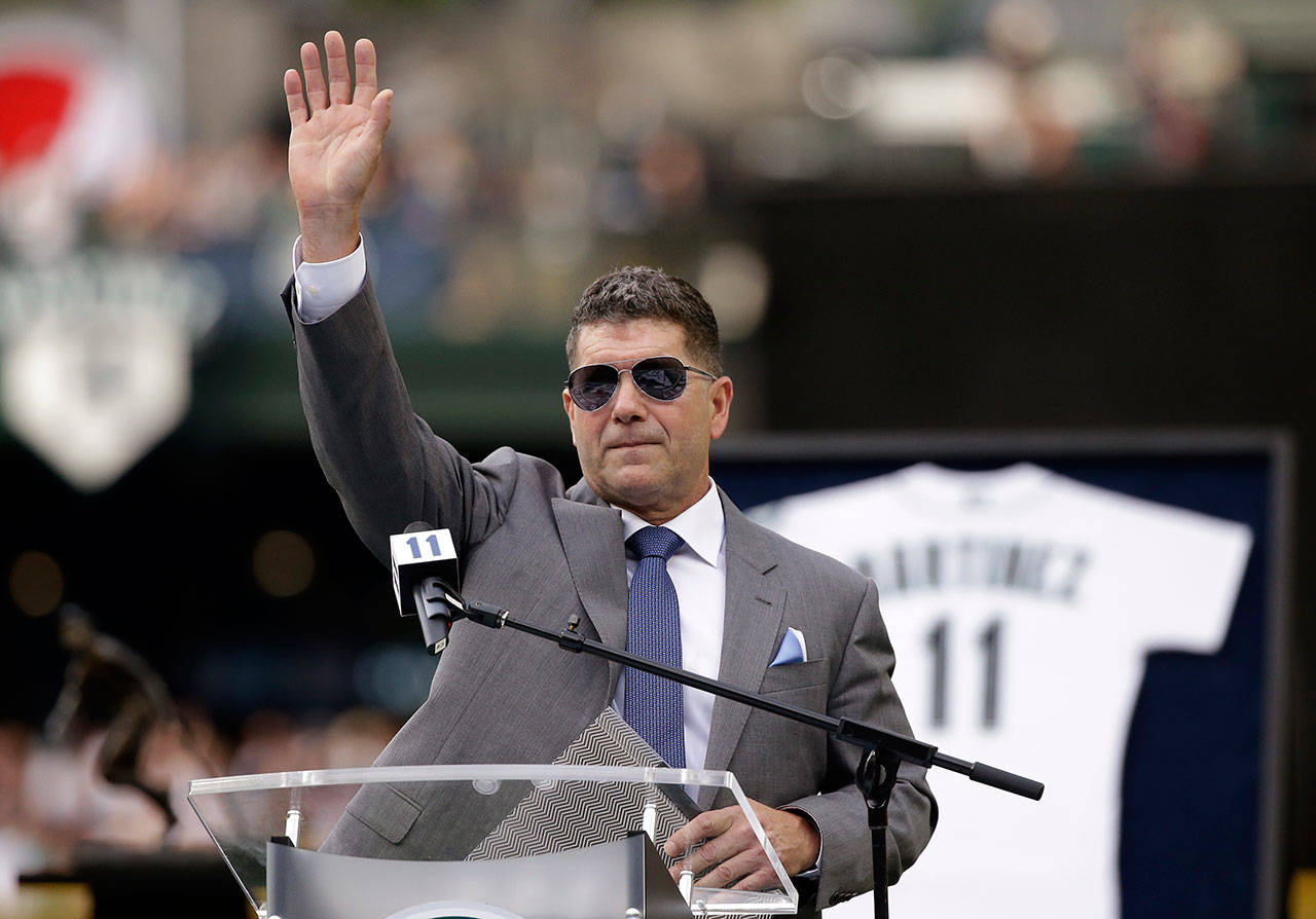 Edgar Martinez waves as he concludes his remarks at a ceremony retiring his No. 11 before a Saturday’s game at Safeco Field. (AP Photo/Elaine Thompson)