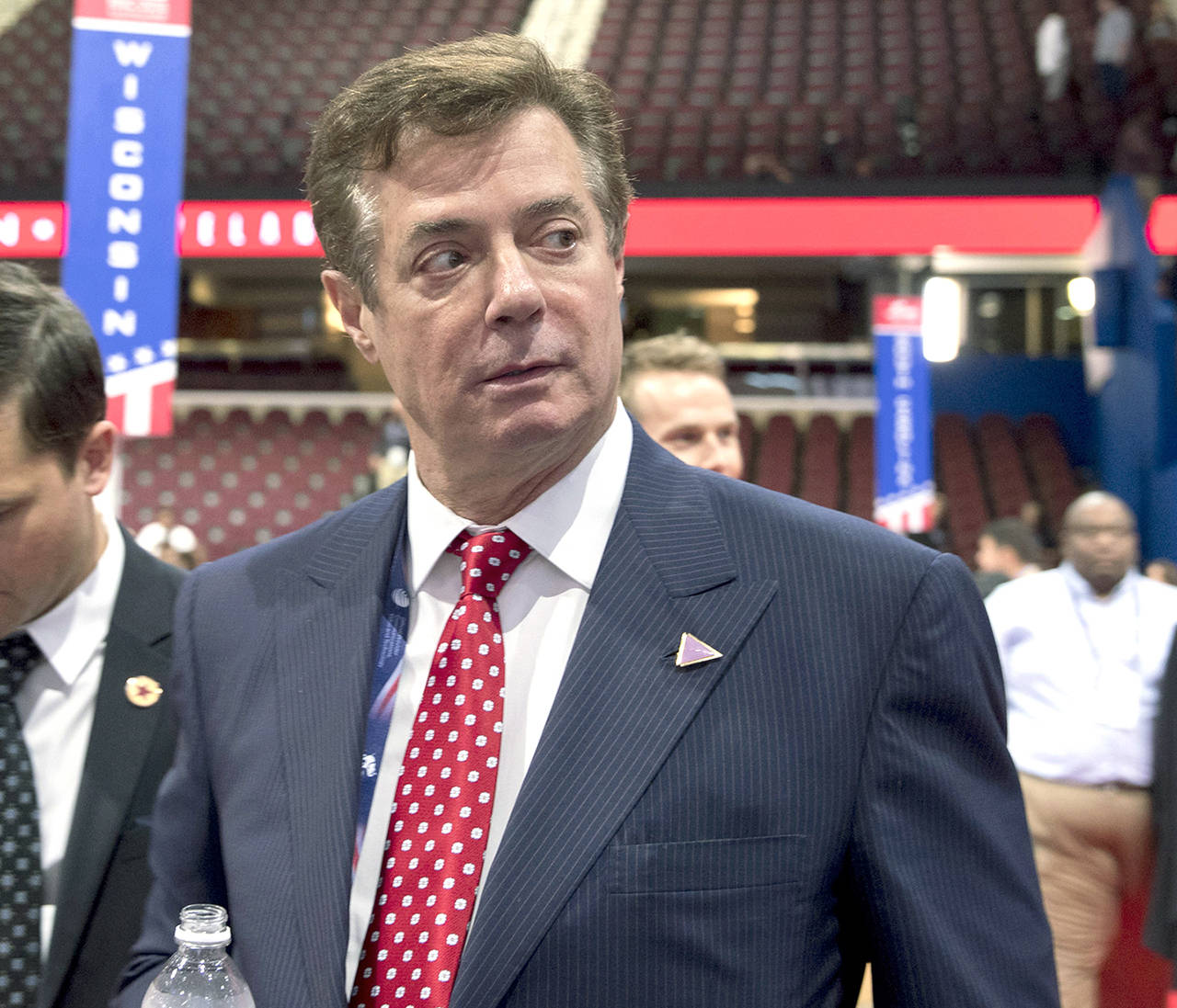 In this 2016 photo, then-Trump campaign chairman Paul Manafort walks around the convention floor before the opening session of the Republican National Convention in Cleveland. (AP Photo/Carolyn Kaster, File)