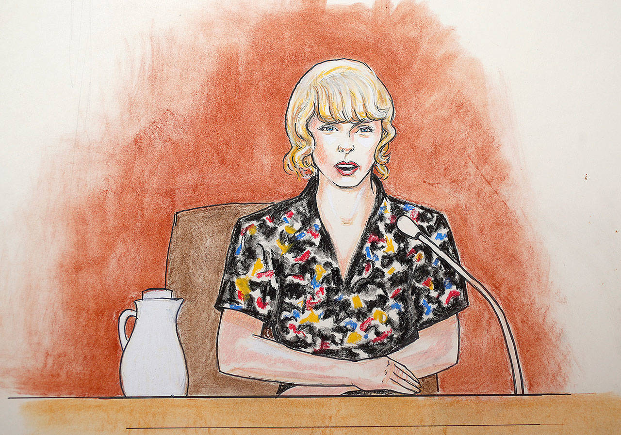 In this courtroom sketch, pop singer Taylor Swift speaks from the witness stand during a trial Thursday in Denver. (Jeff Kandyba via AP)