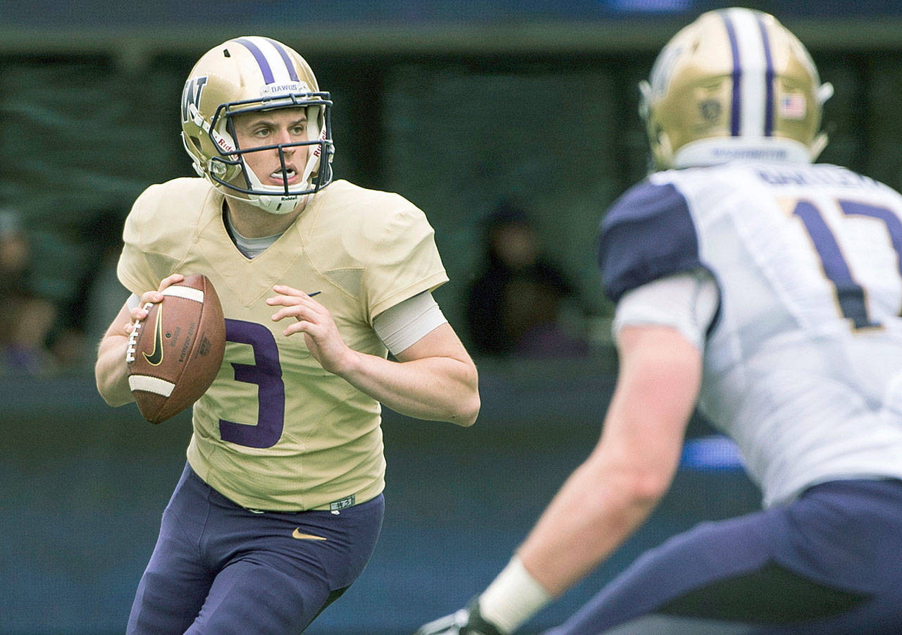 Washingotn’s Jake Browning looks to pass during the Huskies’ spring game on April 22 in Seattle. The challenge for Browning and UW coach Chris Petersen is staying on top of the college football landscape after a milestone season in 2016-17. (Joshua Bessex/The News Tribune via AP, File)