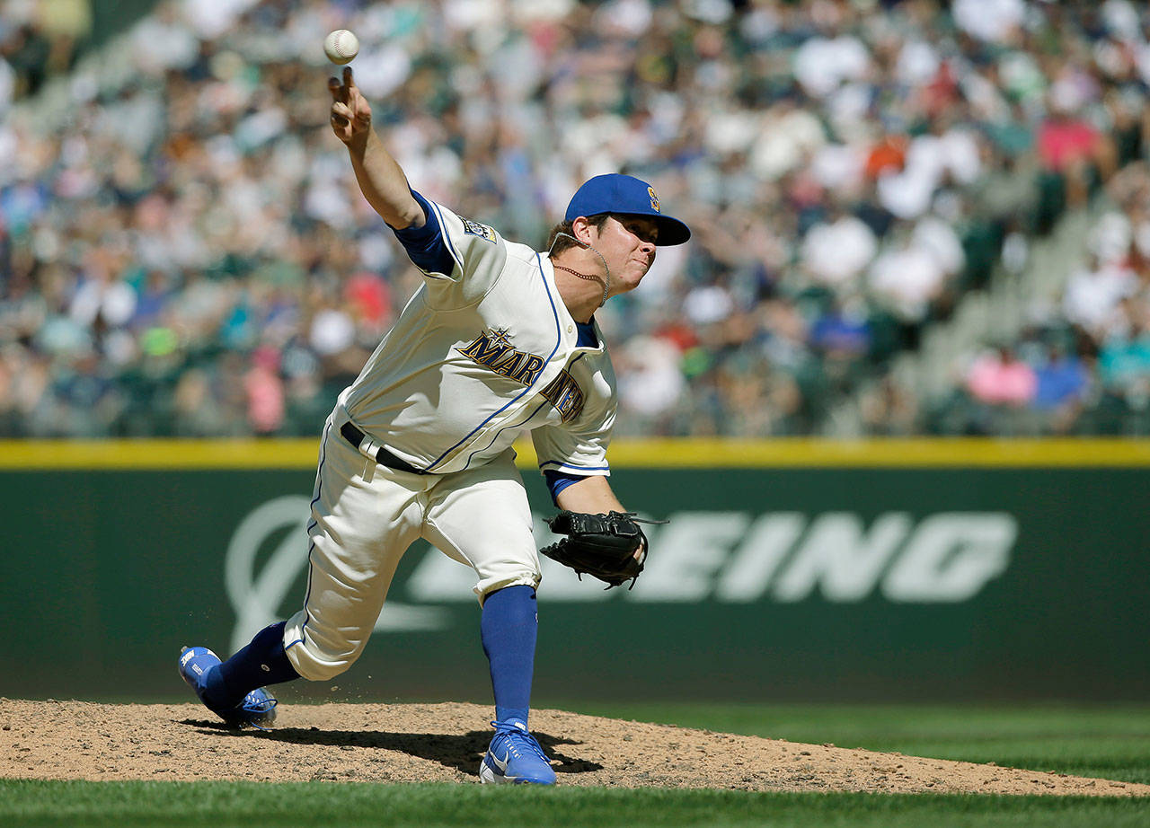 Seattle’s Emilio Pagan throws against the New York Yankees July 23 in Seattle. Pagan and Casey Lawrence have been sharing long-relief duties for the Mariners. (AP Photo/Ted S. Warren)