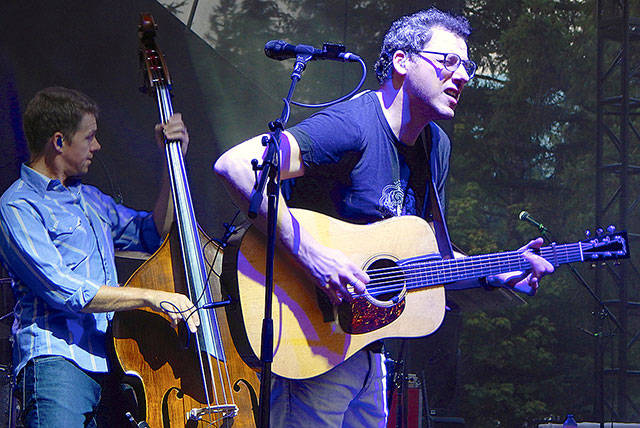 Jon Bauer / The Herald Guitarist Andy Falco of the Infamous Stringdusters gets into the music Aug. 10 at the Summer Meltdown music festival near Darrington.