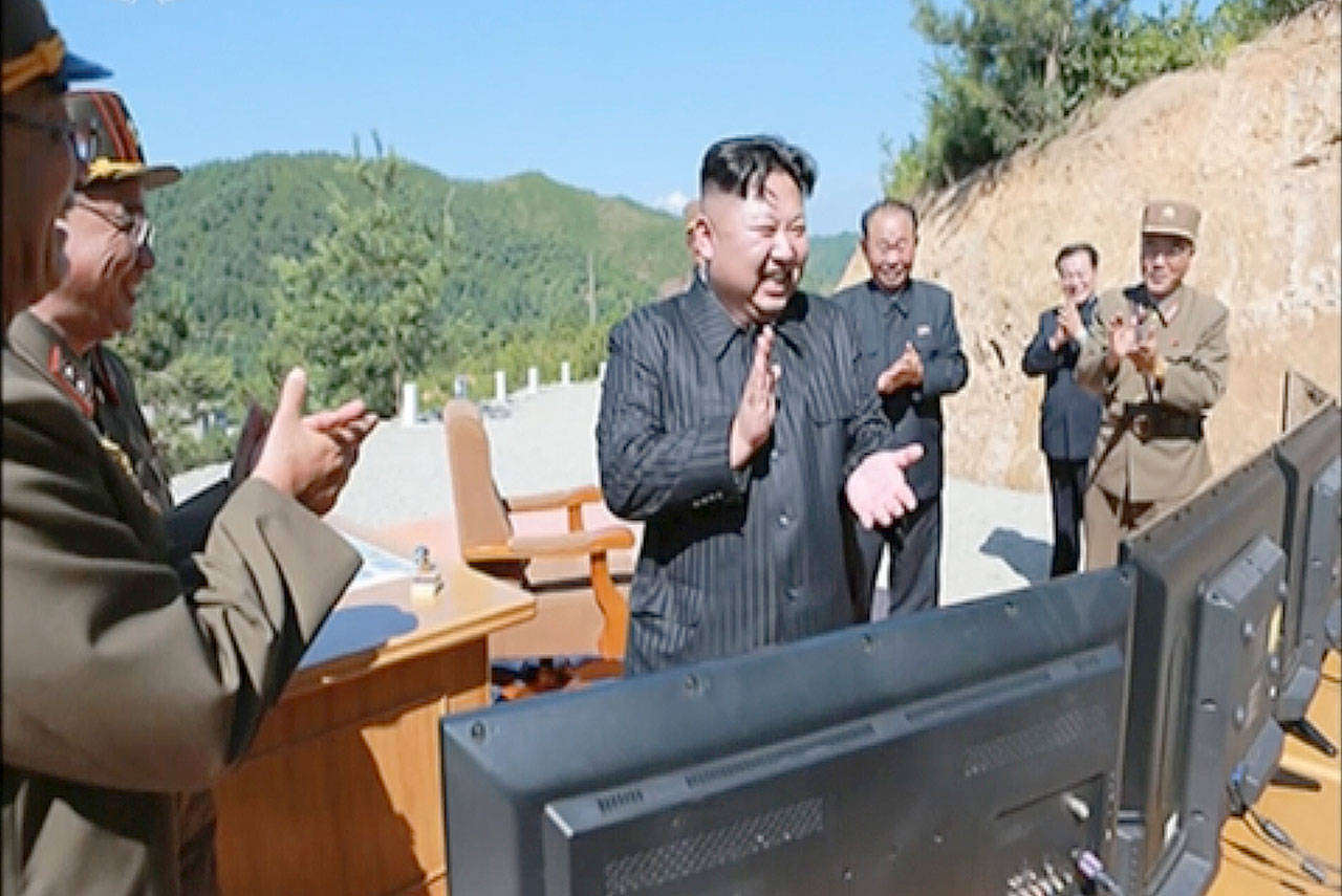 North Korea leader Kim Jung Un applauds after the launch of a Hwasong-14 intercontinental ballistic missile in North Korea in this image from video released on July 4. (KRT)