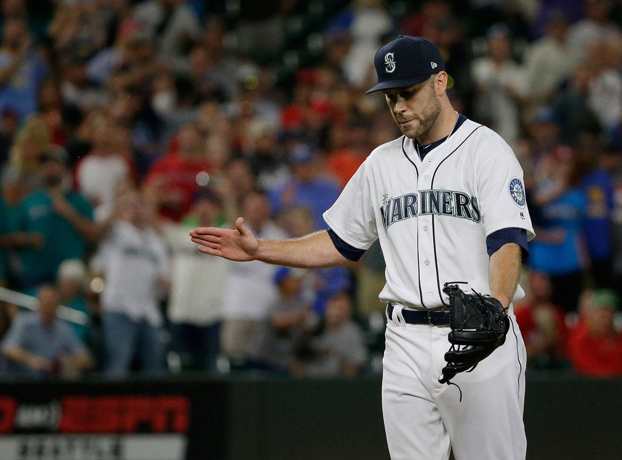 Mariners reliever David Phelps claps his hand into his glove at the end of the ninth inning of a game against the Red Sox on July 24, 2017, in Seattle. (AP Photo/Ted S. Warren)