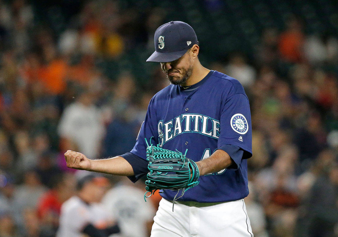 Seattle Mariners starting pitcher Yovani Gallardo leaves the game Monday after giving up eight runs to the Baltimore Orioles in four-plus innings. (AP Photo/Elaine Thompson)