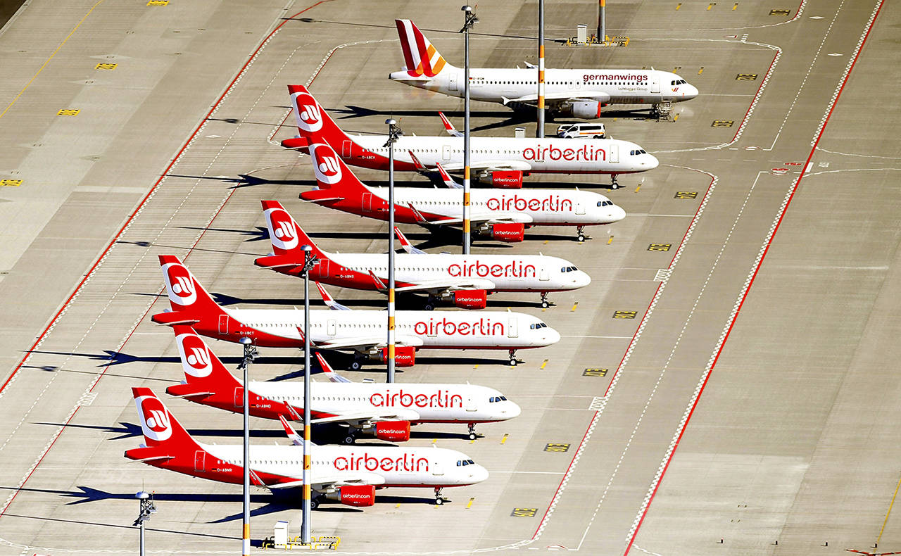 In this May 19 photo, planes of Air Berlin company parked in airport in Schonefeld, Germany. (Ralf Hirschberger/dpa via AP, file)