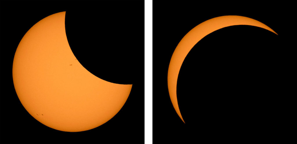 The moon passes in front of the sun during the solar eclipse near Ross Lake in North Cascades National Park on Monday. (Bill Ingalls/NASA via AP) 
