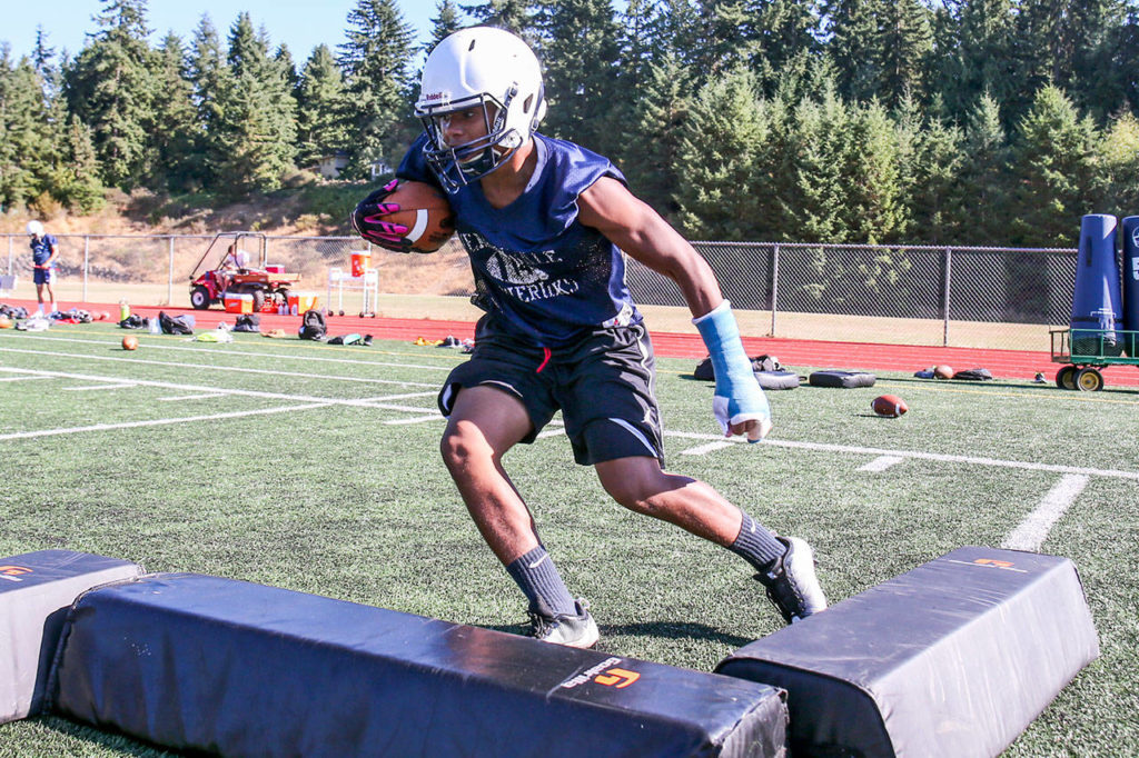 Meadowdale senior Jashon Butler runs through agility drills during practice Aug. 17, 2017, at Meadowdale High School in Lynnwood. (Kevin Clark / The Herald)
