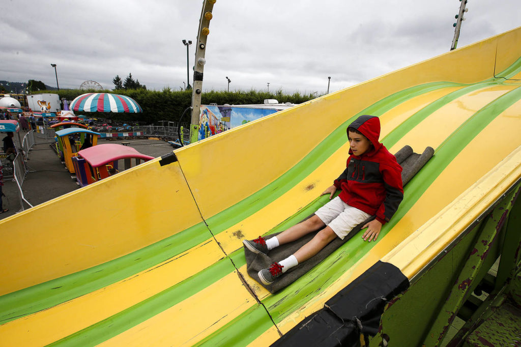 Nate McKiernan, 12, of Duvall, flies down a slide at the Evergreen State Fair in Monroe on Wednesday. (Ian Terry / The Herald)
