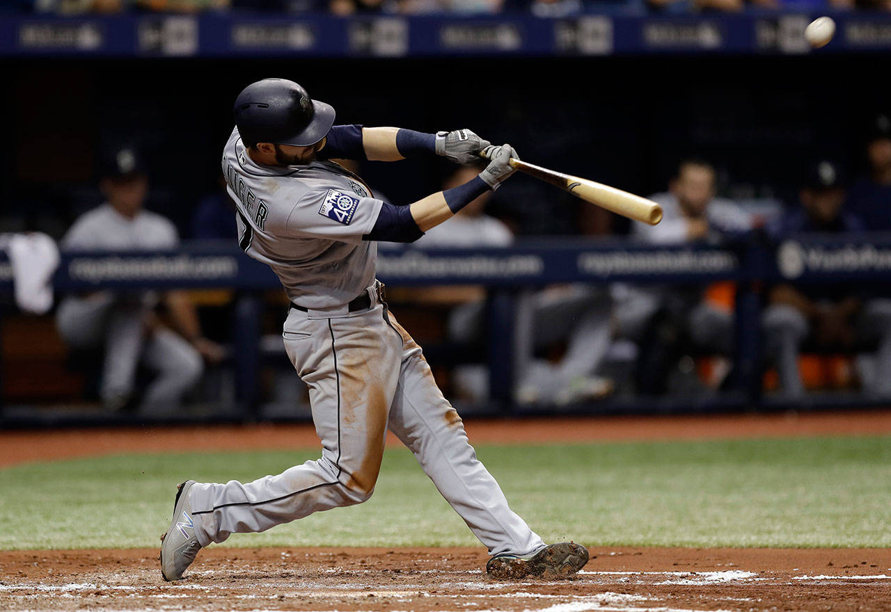 Seattle’s Mitch Haniger connects for a grand slam in the third inning of Saturday’s game in St. Petersburg, Fla. (AP Photo/Chris O’Meara)