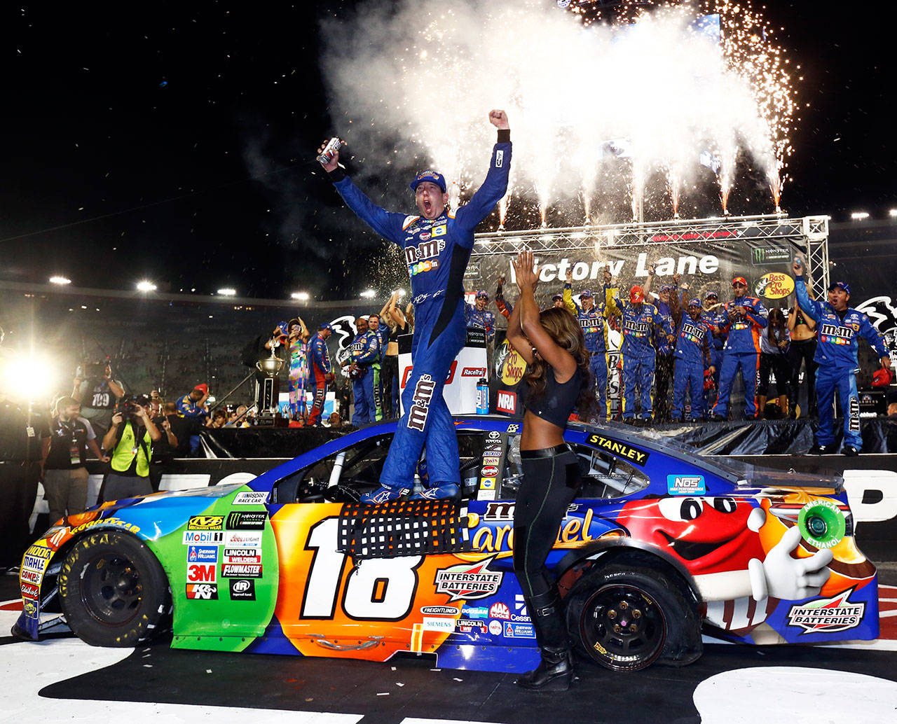 Kyle Busch celebrates in Victory Lane after winning the NASCAR Cup Series race Aug. 19, 2017, in Bristol, Tenn. (AP Photo/Wade Payne)