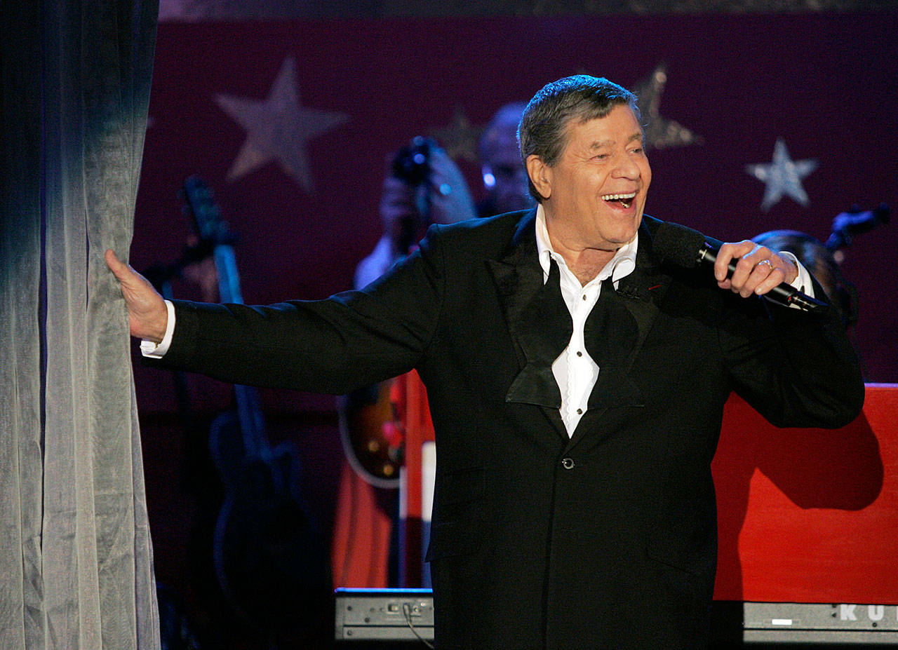 Jerry Lewis performs during the 2005 Muscular Dystrophy Association telethon in Beverly Hills, California. Lewis, the comedian and director whose fundraising telethons became as famous as his hit movies, died Sunday, Aug. 20, 2017, according to his publicist. He was 91. (Associated Press)