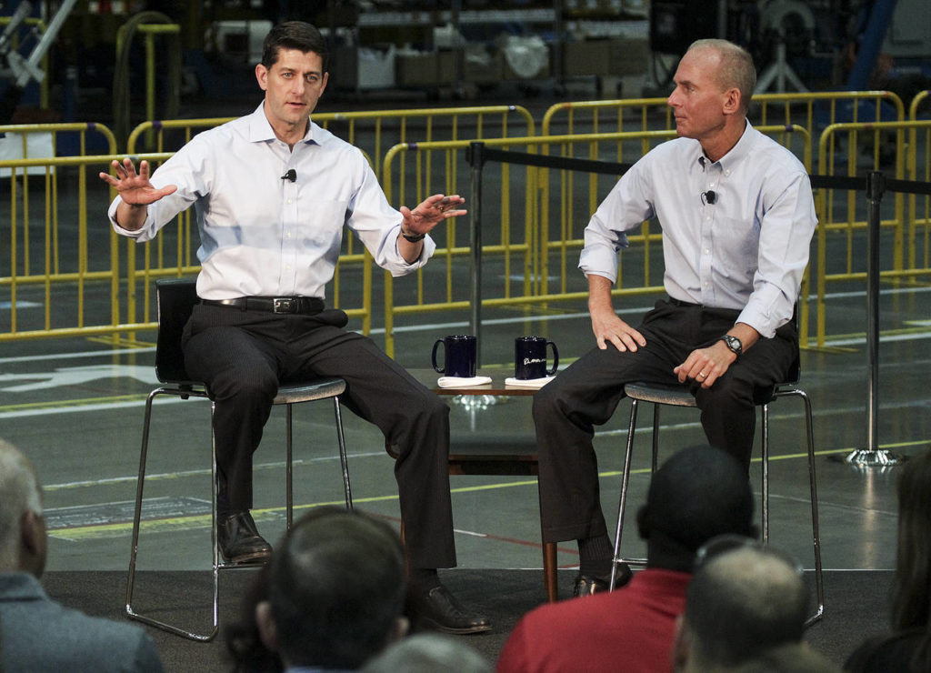 House Speaker Paul Ryan (left) answers questions, with Boeing CEO Dennis Muilenburg, during a town hall at the Boeing factory on Thursday in Everett. (Ian Terry / The Herald)
