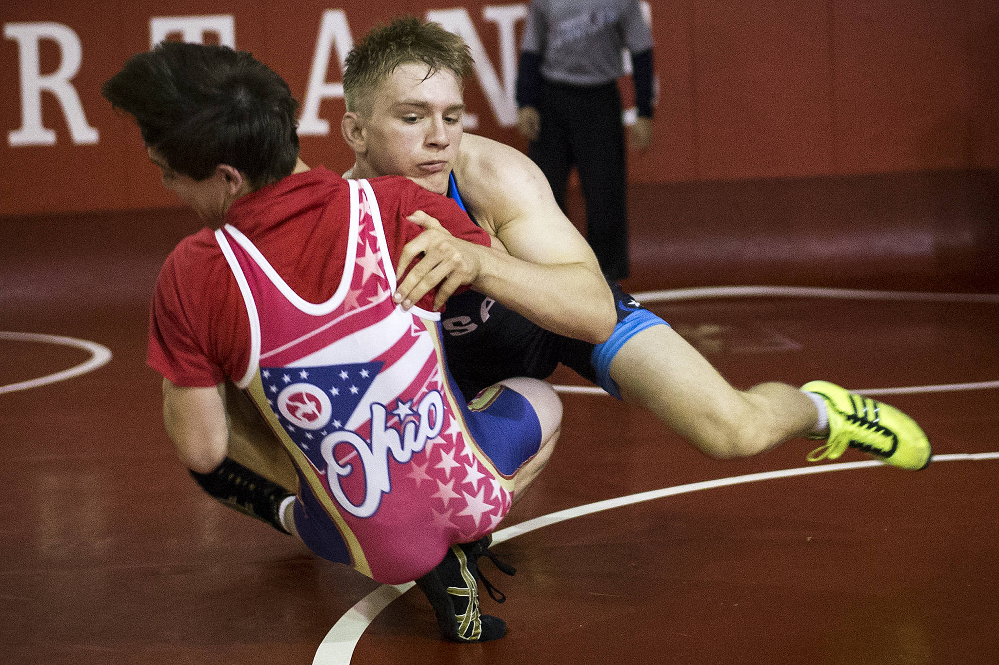 Stanwood wrestler Mason Phillips takes down visiting training partner Lucas Byrd of Akron, Ohio during a training session on Aug. 15, 2017, in Stanwood. (Ian Terry / The Herald)