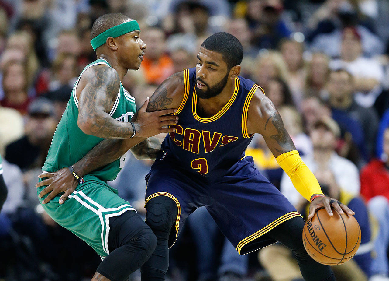 The Cavaliers’ Kyrie Irving (right) looks to drive against the Celtics’ Isaiah Thomas during the first half of a game Nov. 3, 2016, in Cleveland. (AP Photo/Ron Schwane)