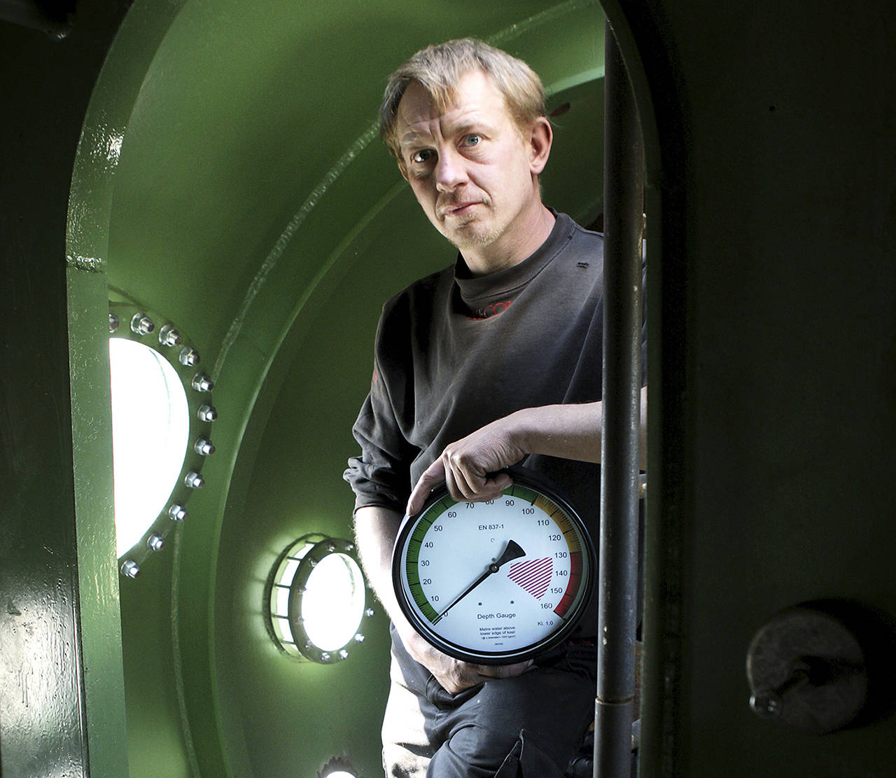 In this 2008 photo, submarine owner Peter Madsen stands inside the vessel. (Niels Hougaard /Ritzau via AP, File)