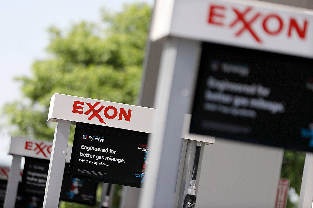 Exxon service station signs are seen in Nashville, Tennessee, in 2017. (AP Photo/Mark Humphrey)