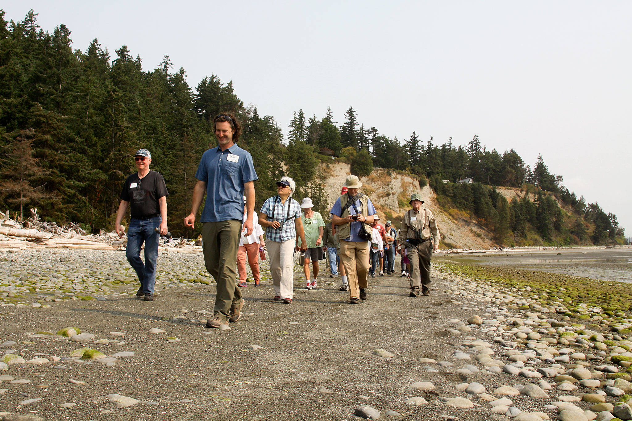 Ryan Elting, conservation director for the Whidbey Camano Land Trust, leads a tour of Barnum Point on Aug. 5. The scenic park, which is being expanded, is located at Triangle Cove on Camano Island. (Whidbey Camano Land Trust)
