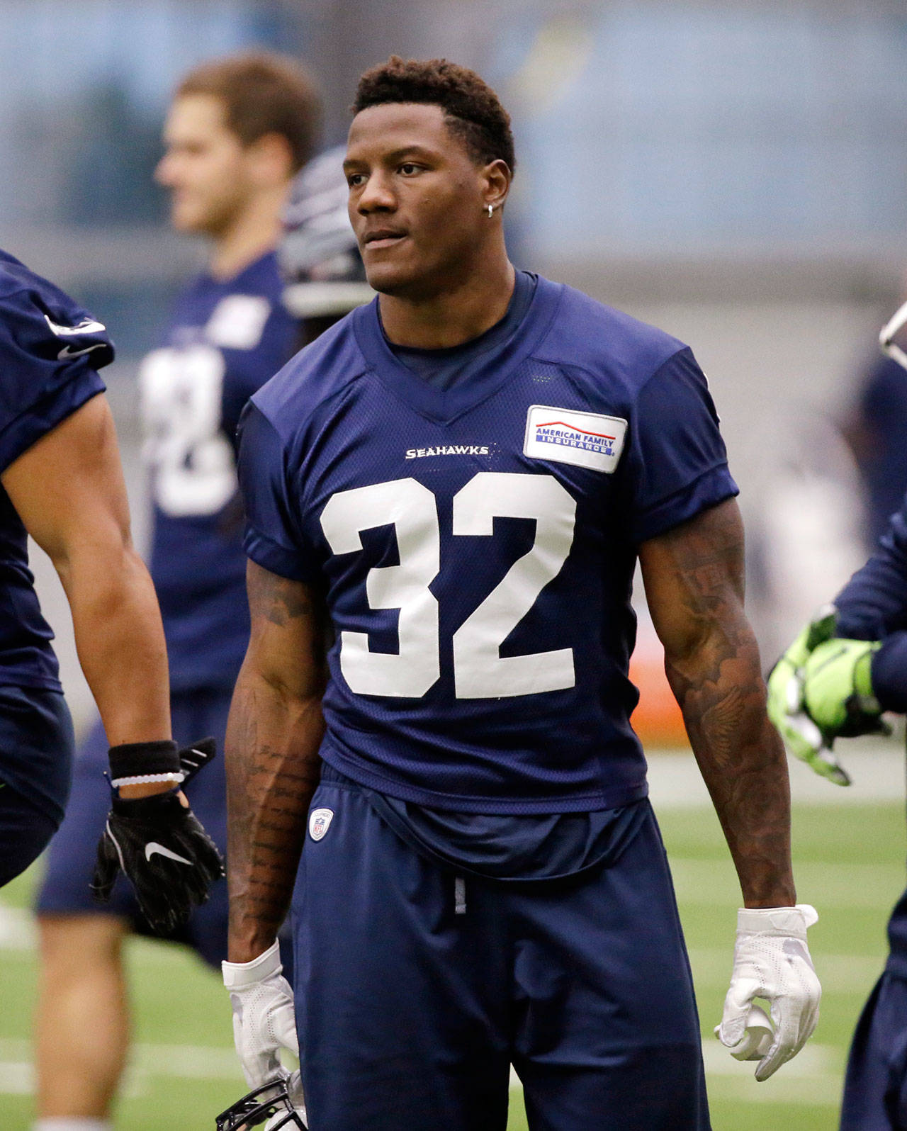 Seahawks running back Chris Carson walks on the field during practice June 15, 2017, in Renton. (AP Photo/Elaine Thompson)