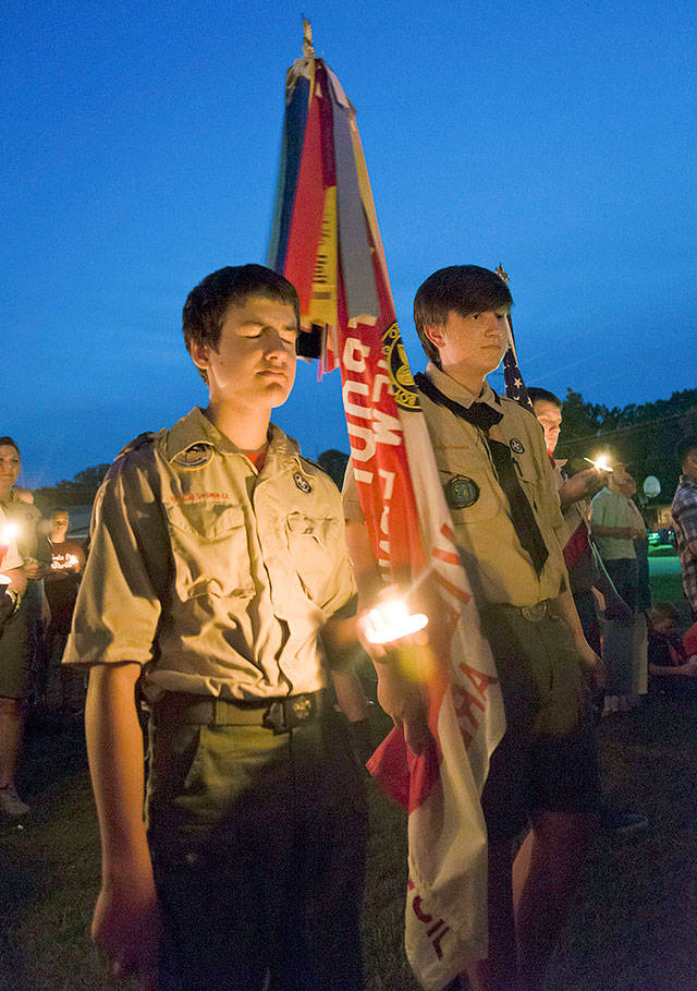 Boy Scouts participate in a candlelight vigil Aug. 6 in Hallsville, Texas. (Les Hassell/The News-Journal)